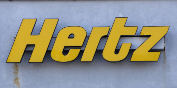 A Hertz rental car logo rests on the front of a Hertz location, in Boston on Nov. 28, 2017. (Steven Senne/AP Photo)
