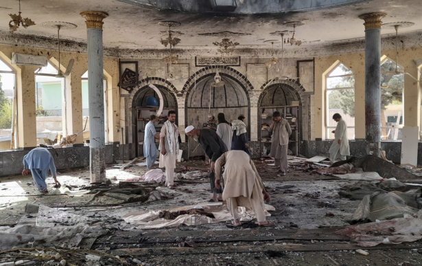 Afghans inspect the inside of a mosque following a bombing in Kunduz province in northern Afghanistan, on Oct. 8, 2021. (Abdullah Sahil/AP Photo)