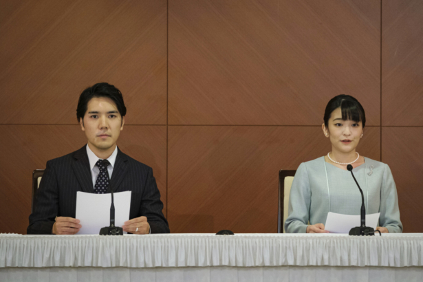 Princess Mako, the elder daughter of Prince Akishino and Princess Kiko, and her husband Kei Komuro, a university friend of Princess Mako, attend a press conference to announce their marriage registration at Grand Arc Hotel in Tokyo, Japan, on Oct. 26, 2021. (Nicolas Datiche/Pool Photo via AP)