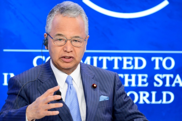 Then Japanese Economy Minister Akira Amari gestures during a session of the World Economic Forum annual meeting on Jan. 23, 2016. (Fabrice Coffrini/AFP via Getty Images)