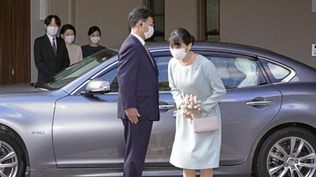 Japan's Princess Mako bows before leaving her home in Akasaka Estate in Tokyo on Oct. 26, 2021. (Koki Sengoku/Kyodo News via AP)