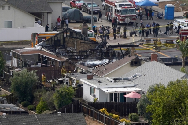Emergency crews work at the scene of a small plane crash, in Santee, Calif., on Oct. 11, 2021. (Gregory Bull/AP Photo)