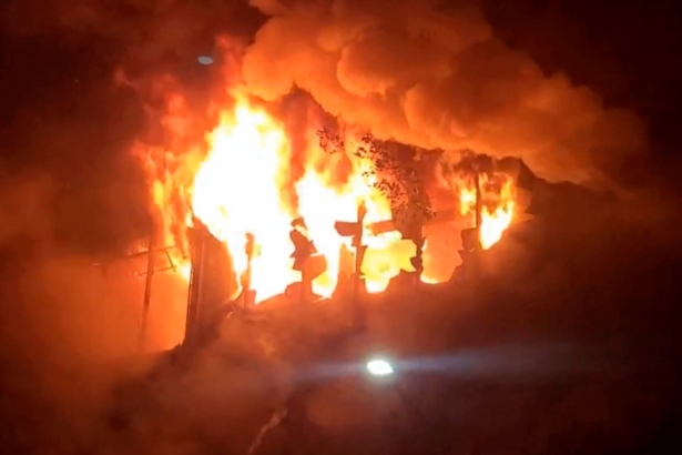 In this image taken from video by Taiwan's EBC, fire and smoke pour out from a building in Kaohsiung, in southern Taiwan on Oct. 14, 2021. (EBC via AP )