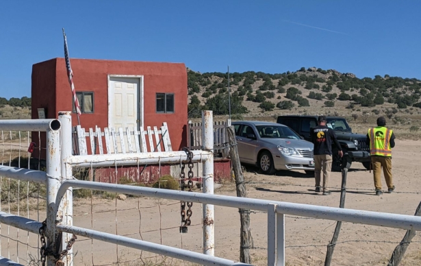 Security guards stand at the entrance of Bonanza Creek Ranch in Santa Fe, New Mexico, on Oct. 22, 2021. (Anne Lebreton/AFP via Getty Images)