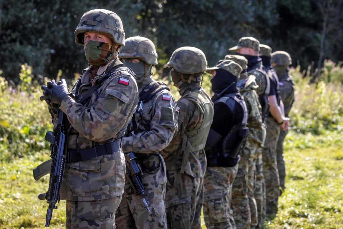Armed Polish border guards stand at the Polish-Belarusian border in Usnarz Gorny, near Bialystok, northeast Poland, on Aug. 20, 2021. (Wojtek Radwanski/AFP via Getty Images)