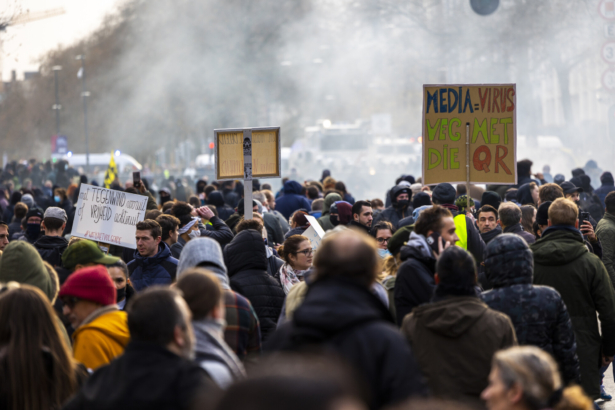 People gather for a protest against the health pass (Ensemble pour la Liberte) and other COVID-19 measures, in Brussels, Belgium, on Nov. 21, 2021. (Hadrien Dure/Belga Mag/AFP via Getty Images)