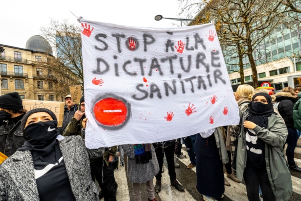 People take part in a demonstration against COVID-19 measures, including the country's health pass, in Brussels, Belgium, on Nov. 21, 2021. (Hadrien Dure/Belga/AFP via Getty Images)