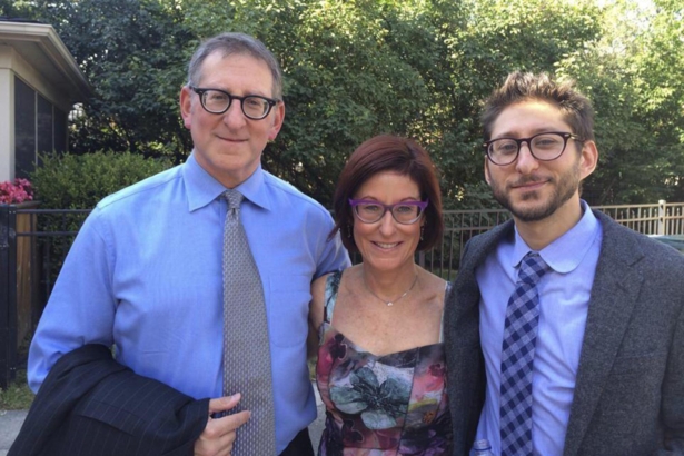 Danny Fenster (R) and his family, Buddy and Rose Fenster, pose for a photo in Huntington Woods, Mich., in 2014. (Family courtesy photo via AP)
