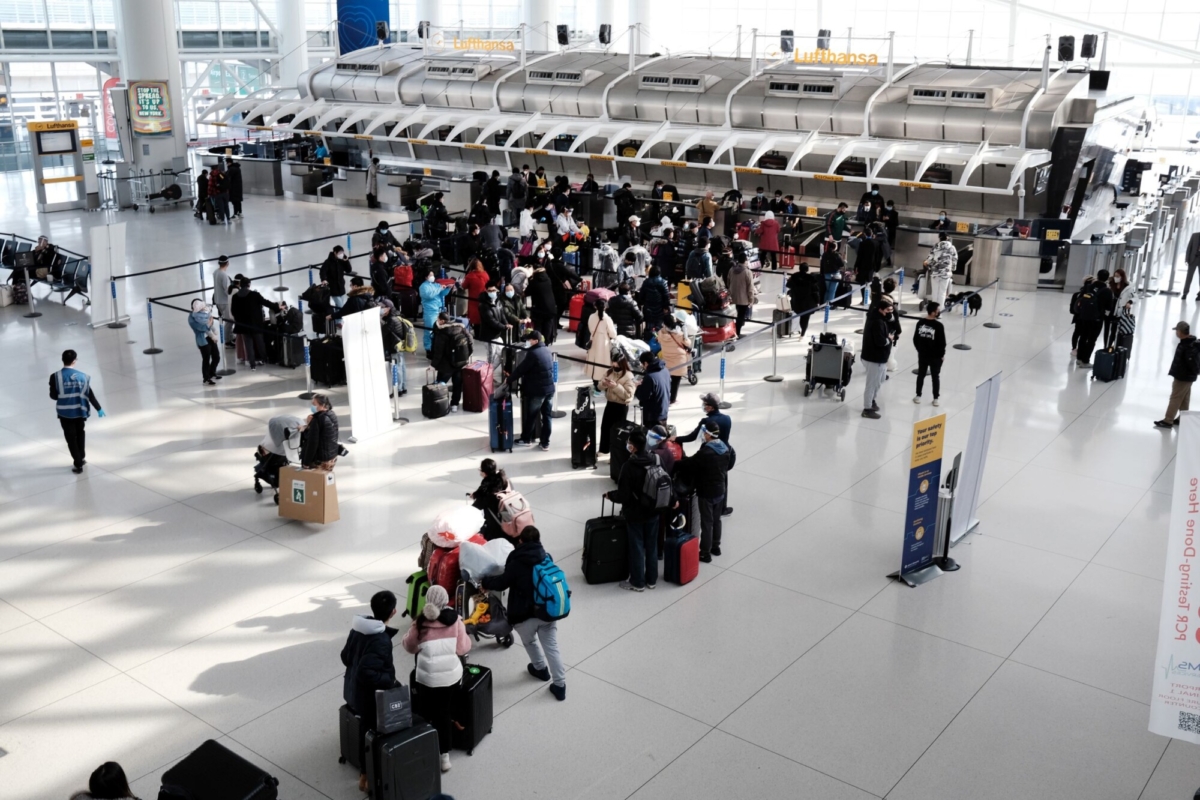 People wait for a flight at an international terminal at John F. Kennedy Airport (JFK) in New York City, on Jan. 25, 2021. (Spencer Platt/Getty Images
