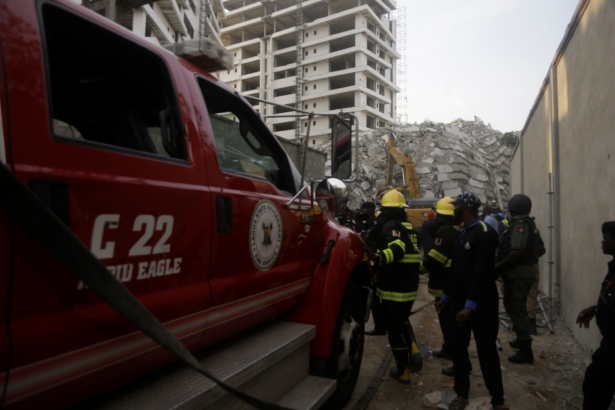 Rescue workers are seen at the site of a collapsed 21-story apartment building under construction in Lagos, Nigeria, on Nov. 1, 2021. (Sunday Alamba/AP Photo)