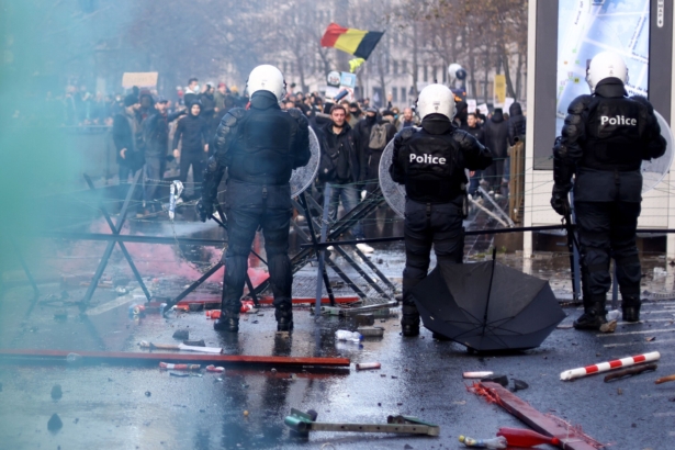 Protesters confront riot police during a demonstration against Belgium government's COVID-19 measures and mandatory vaccination in Brussels on Nov. 21, 2021. (Kenzo Tribouillard/AFP via Getty Images)