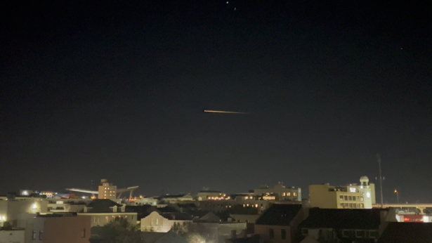 SpaceX Crew-2 streaks across the sky as it makes its return to Earth, in New Orleans, La., on Nov. 8, 2021, in this still image taken from a social media video. (@_tehgreat/via Reuters)