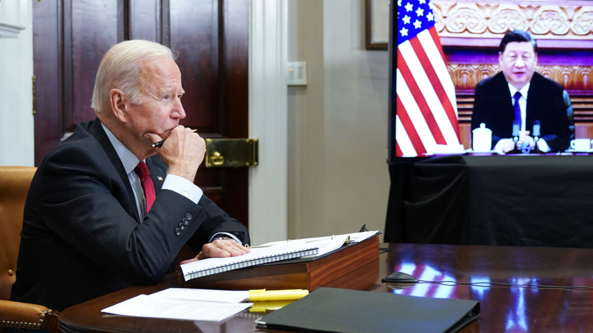 U.S. President Joe Biden meets with China's President Xi Jinping during a virtual summit from the Roosevelt Room of the White House in Wash. on Nov. 15, 2021. (Mandel Ngan/AFP via Getty Images)