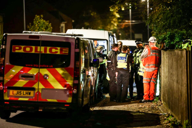 Police and emergency services personnel work at the site where two trains collided near Salisbury, Britain, early on Nov. 1, 2021. (Henry Nicholls/Reuters)