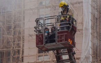Major Fire Traps 300 in Hong Kong’s World Trade Center, 13 Injured