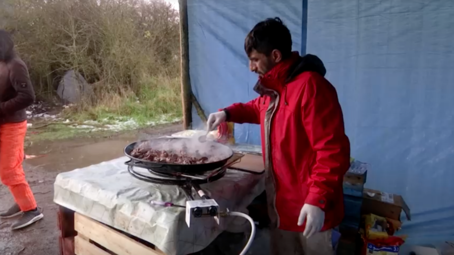 Migrant Works to Pay Smuggler's Fee to UK