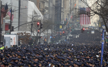 Thousands Attend Funeral for First of Two Slain NYPD Officers