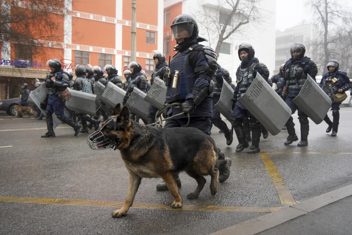 Riot police walk to block demonstrators gathering during a protest in Almaty, Kazakhstan, on Jan. 5, 2022. (Vladimir Tretyakov/AP Photo)