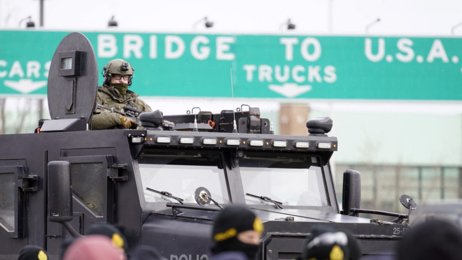 Police Move in to Clear Blockade at Canada-US Border Crossing Bridge in Windsor