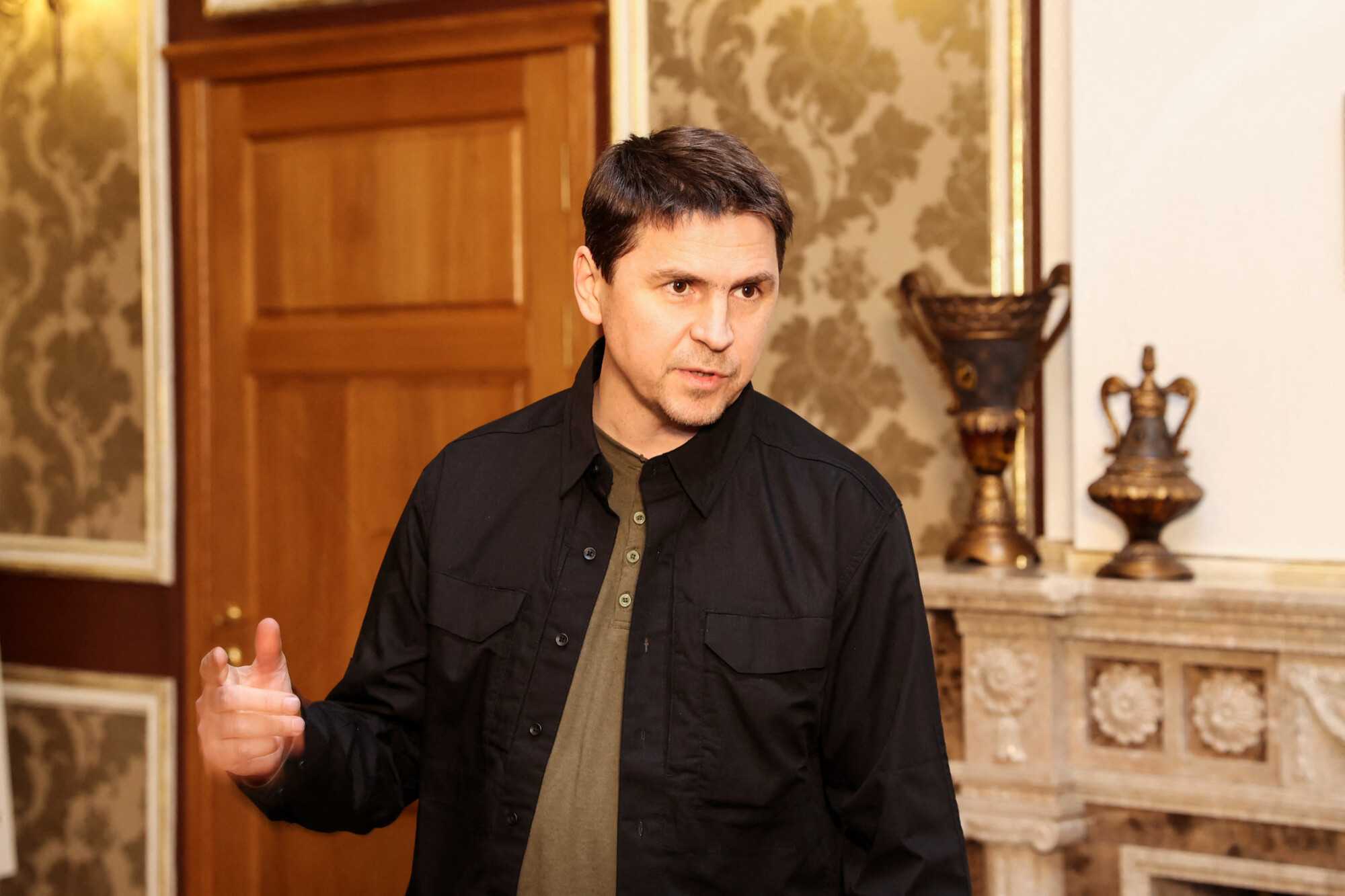 Ukrainian negotiator Mikhailo Podolyak speaks to media after talks between delegations from Ukraine and Russia in Belarus on Feb. 28, 2022. (Sergei Kholodilin/AFP via Getty Images)