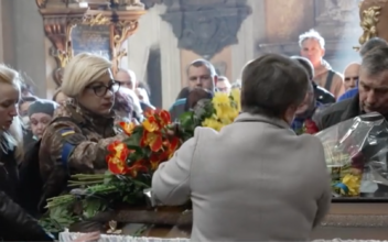 Ukrainians Attend Funeral for Fallen Soldier