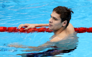 Russian Swimmer Competes Despite Ban