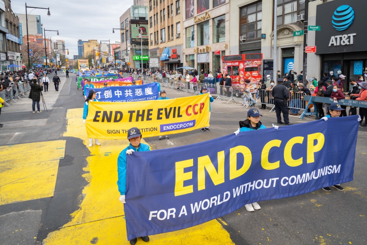 Falun Gong practitioners participate in a parade to commemorate the 23rd anniversary of the April 25th peaceful appeal of 10,000 Falun Gong practitioners in Beijing, in Flushing, New York, on April 23, 2022. (Zhang Jingyi/The Epoch Times)