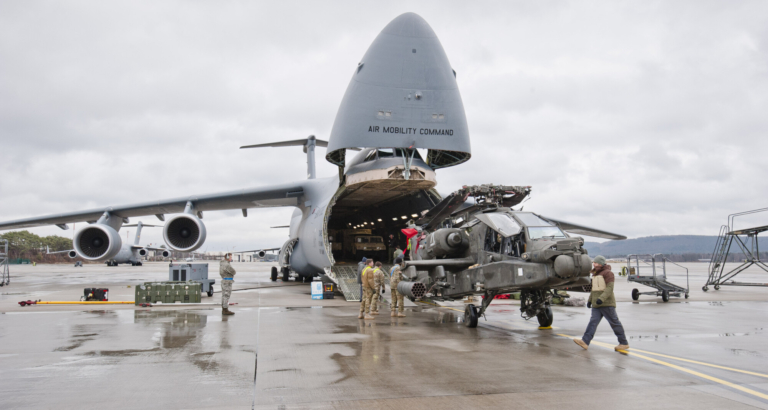 An Apache attack helicopter is being unloaded from a Galaxy C-5 transport plane at the U.S. Air Base in Ramstein, western Germany, on Feb. 22, 2017. (Martin Goldhahn/AFP/Getty Images)