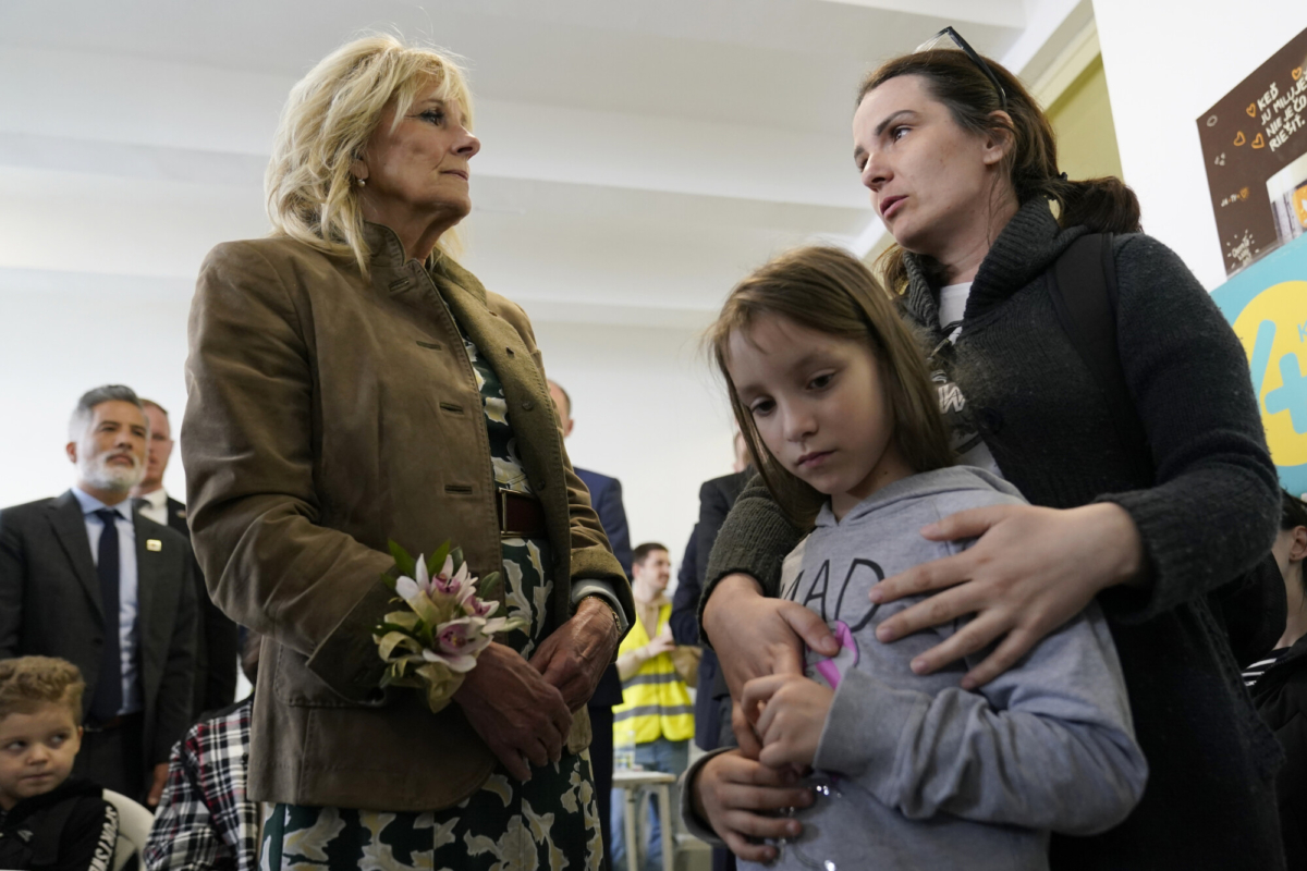 First Lady Jill Biden talks with Ukrainian refugees Victorie Kutocha and her daughter Yulie Kutocha, 7, at a city-run refugee center in Kosice, Slovakia, on May 8, 2022. (Susan Walsh/AP Photo, Pool)