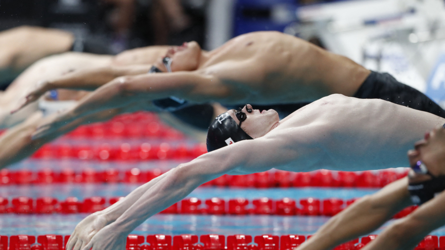 American Armstrong Takes 50m Backstroke Gold, McIntosh Wins 400m Medley
