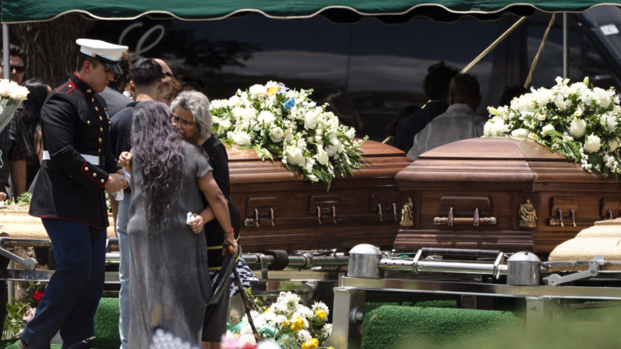 Mourners Say Goodbye to Teacher, 10-Year-Old Boy