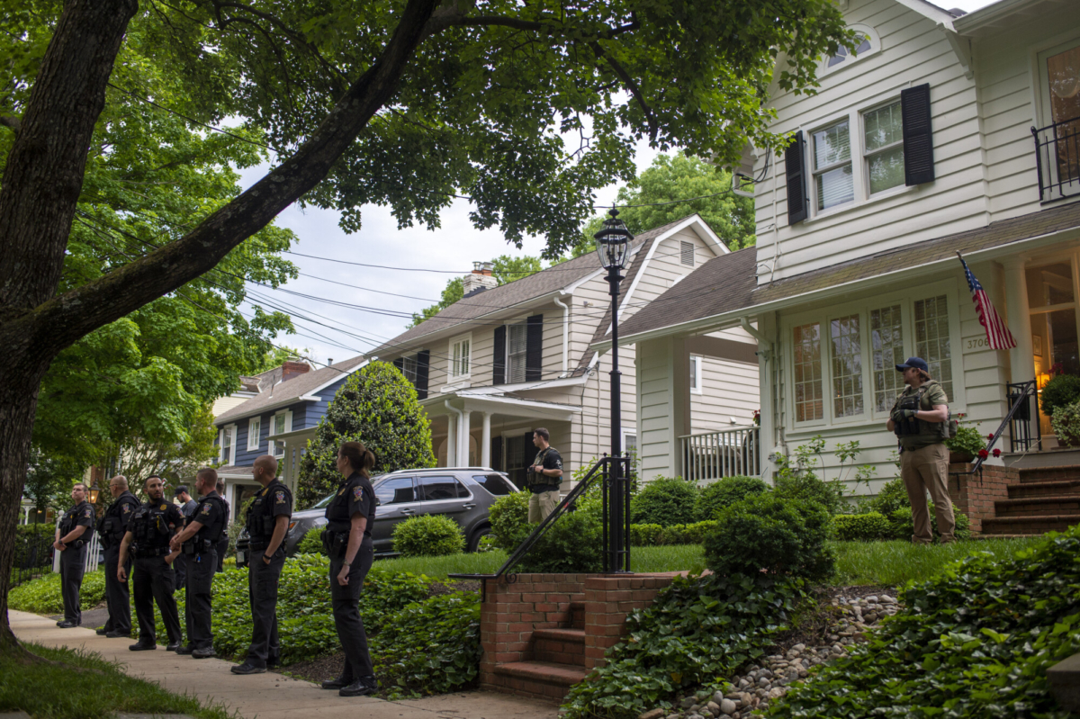 Police officers stand outside the home of U.S. Supreme Court Justice Brett Kavanaugh in Chevy Chase, Md., on May 18, 2022. (Bonnie Cash/Getty Images)