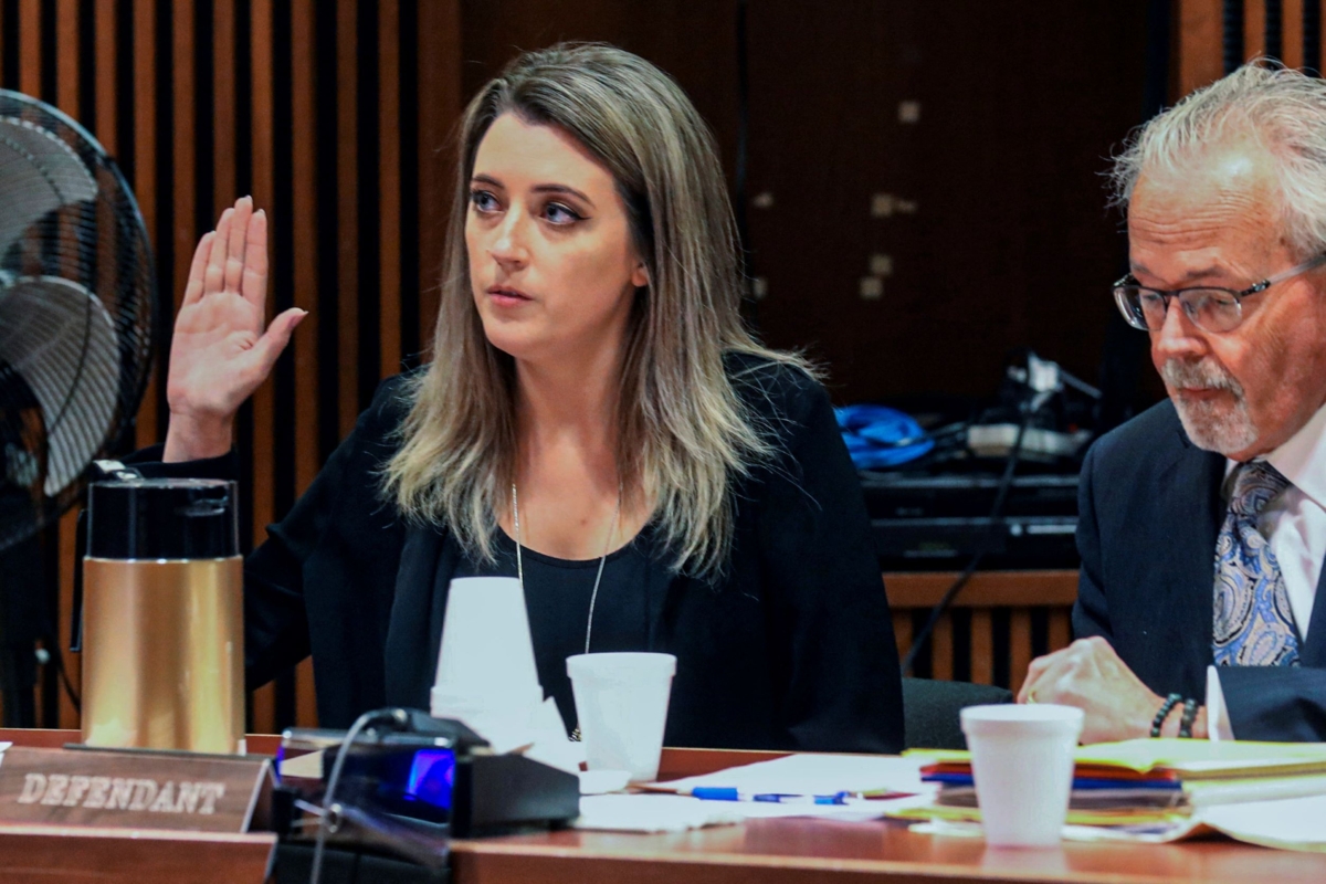 Kate McClure, 32, charged with theft by deception in the $400,00 GoFundMe scam, with her lawyer Jim Gerrow Jr., in State Superior Court, Burlington County Courthouse in Mt. Holly, N.J., on April 15, 2019. (David Swanson/The Philadelphia Inquirer via AP)