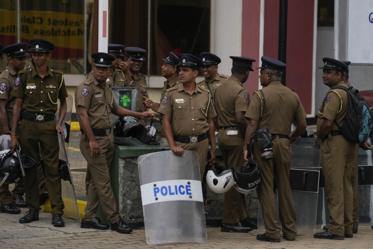 Police officers stand guard outside the official residence of the president in Colombo, Sri Lanka, on July 21, 2022. (Rafiq Maqbool/AP Photo)