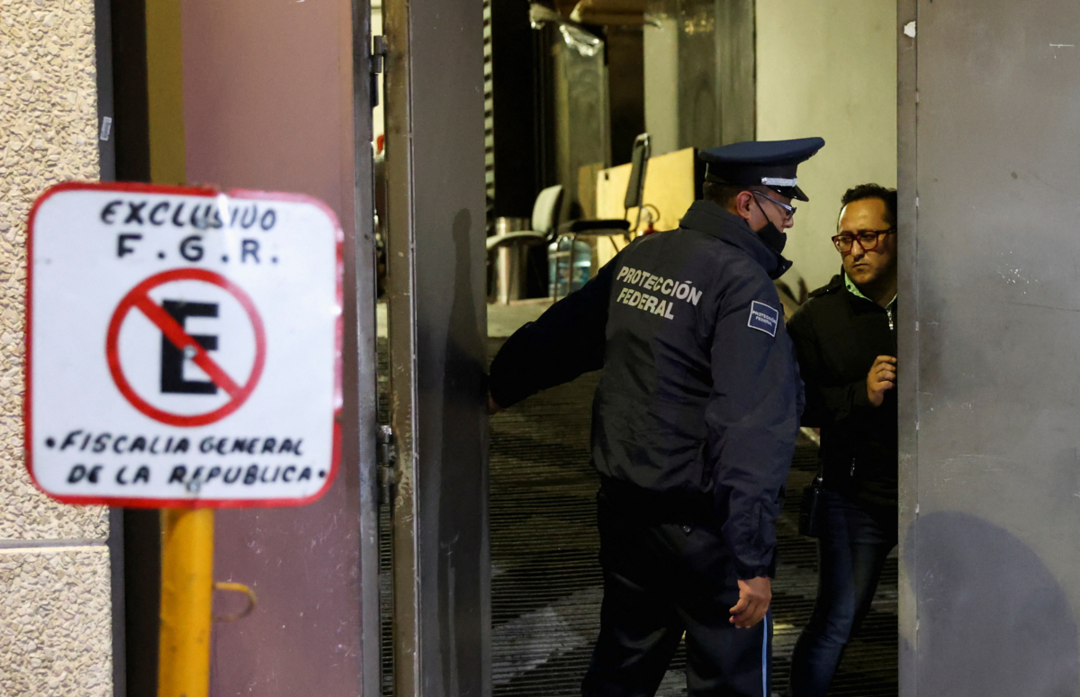 A member of the Federal Protection Services stands outside the facilities of Mexico's Attorney General Office (PFR) in Mexico City on Aug. 20, 2022. (Luis Cortes/Reuters)