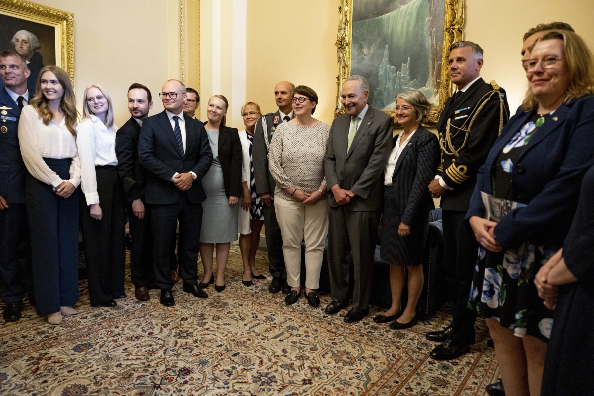 Senate Majority Leader Chuck Schumer (D-N.Y.) poses for a photo with an official delegation from Finland and Sweden in his office at the U.S. Capitol Building in Washington on Aug. 3, 2022. (Anna Moneymaker/Getty Images)