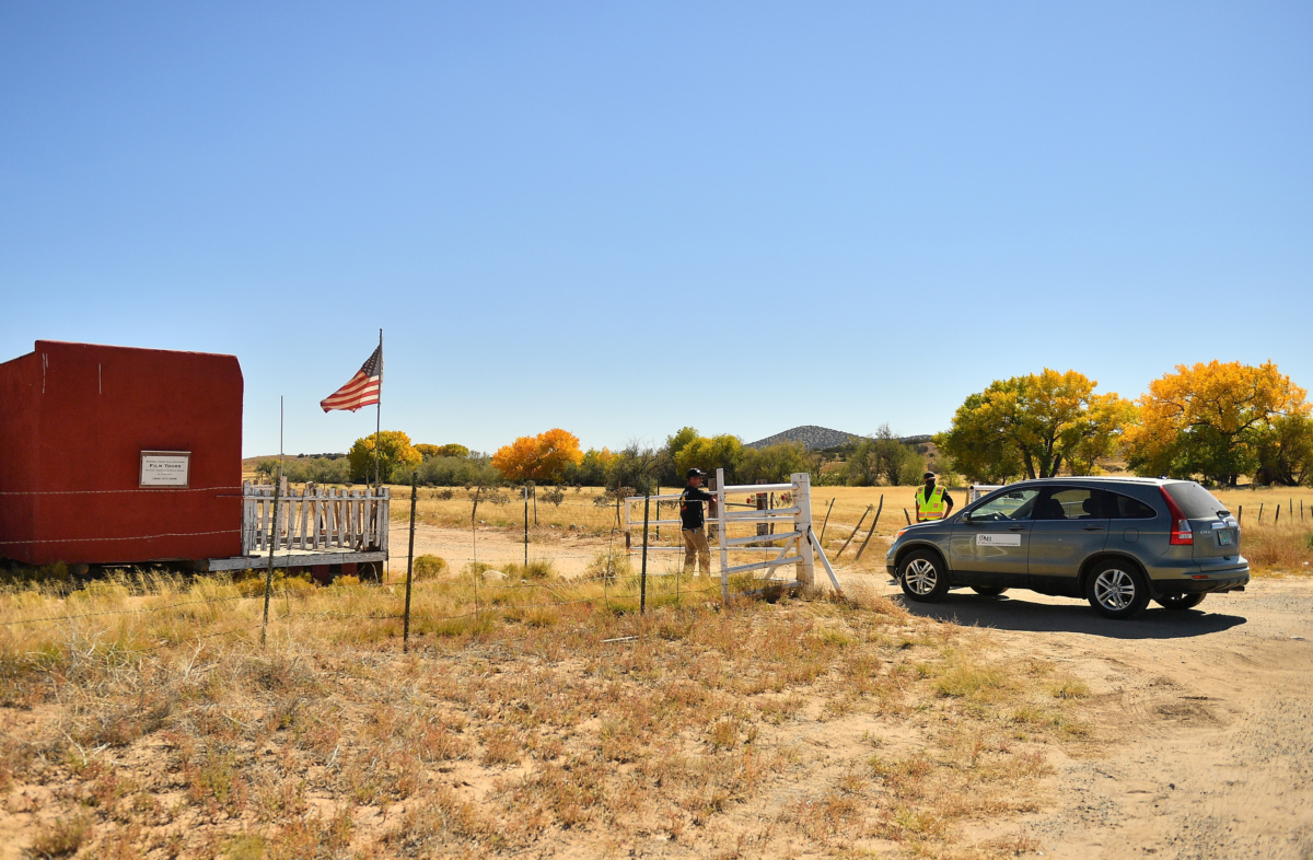 A vehicle from the Office of the Medical Investigator enters the front gate leading to the Bonanza Creek Ranch in Santa Fe, N.M., on Oct. 22, 2021. (Sam Wasson/Getty Images)