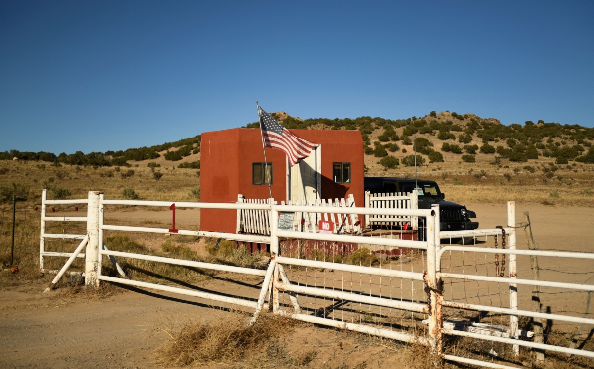 A U.S. flag flies at the entrance to the "Rust" movie set at the Bonanza Creek Ranch in Santa Fe, N.M., on Oct. 28, 2021. (Patrick T. Fallon/AFP via Getty Images)