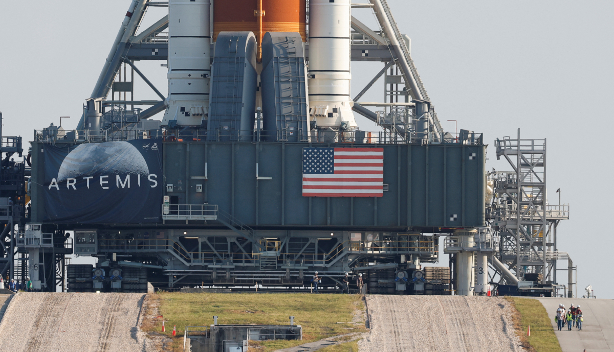 NASA's next-generation moon rocket, the Space Launch System (SLS) Artemis 1 rocket with its Orion crew capsule stands on launch pad 39B as workers depart at the Kennedy Space Center in Cape Canaveral, Fla., on Aug. 17, 2022. (Steve Nesius/Reuters)