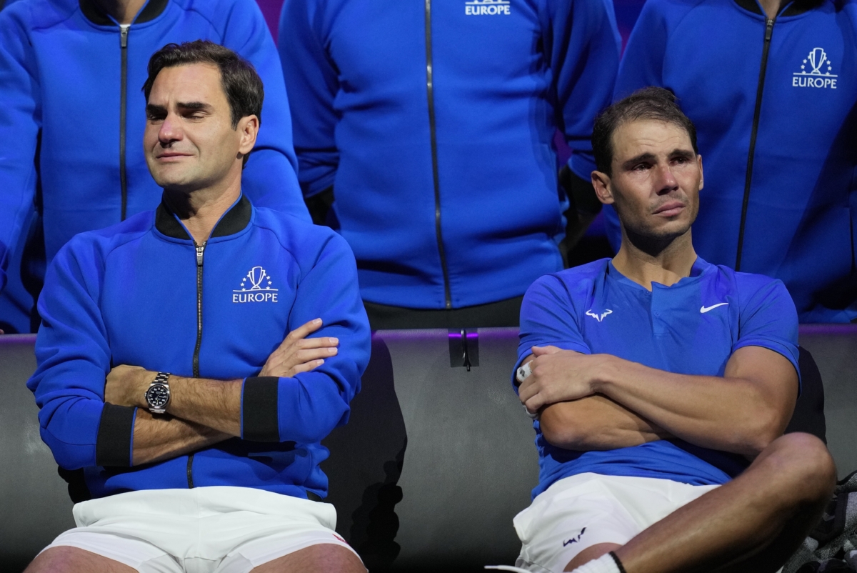 An emotional Roger Federer (L) of Team Europe sits alongside his playing partner Rafael Nadal after their Laver Cup doubles match against Team World's Jack Sock and Frances Tiafoe at the O2 arena in London on Sept. 23, 2022. (Kin Cheung/AP Photo)