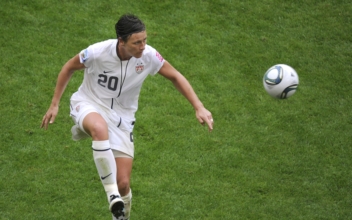 Wambach Divests From Favre-Backed Drug Company in Welfare Fraud Case
