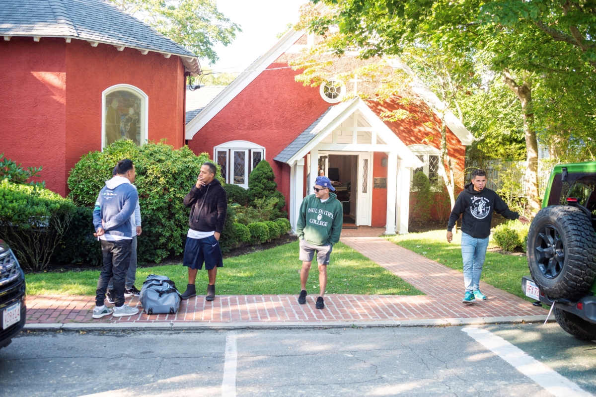 Illegal immigrants gather, after being flown in from Texas on a flight funded by Florida Gov. Ron DeSantis, at Edgartown on the island of Martha's Vineyard, Mass., on Sept. 15, 2022. (Vineyard Gazette/Handout via Reuters)
