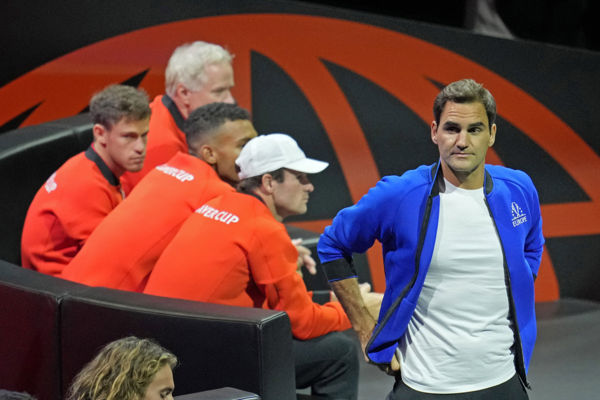Team Europe's Roger Federer of Switzerland waves during the match of Team Europe's Casper Ruud against Team World's Jack Sock on day one of the Laver Cup tennis tournament at the O2 in London on Sept. 23, 2022. (Kin Cheung/AP Photo)