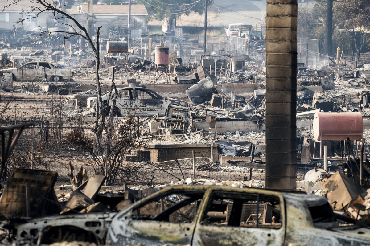 Homes and vehicle destroyed by the Mill Fire in Wakefield Avenue in Weed, Calif., on Sept. 3, 2022. (Noah Berger/AP Photo)