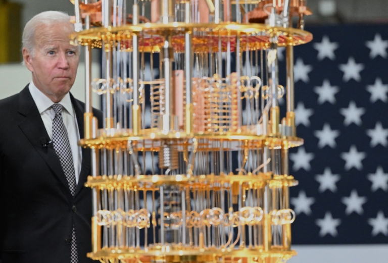 US President Joe Biden looks at a quantum computer