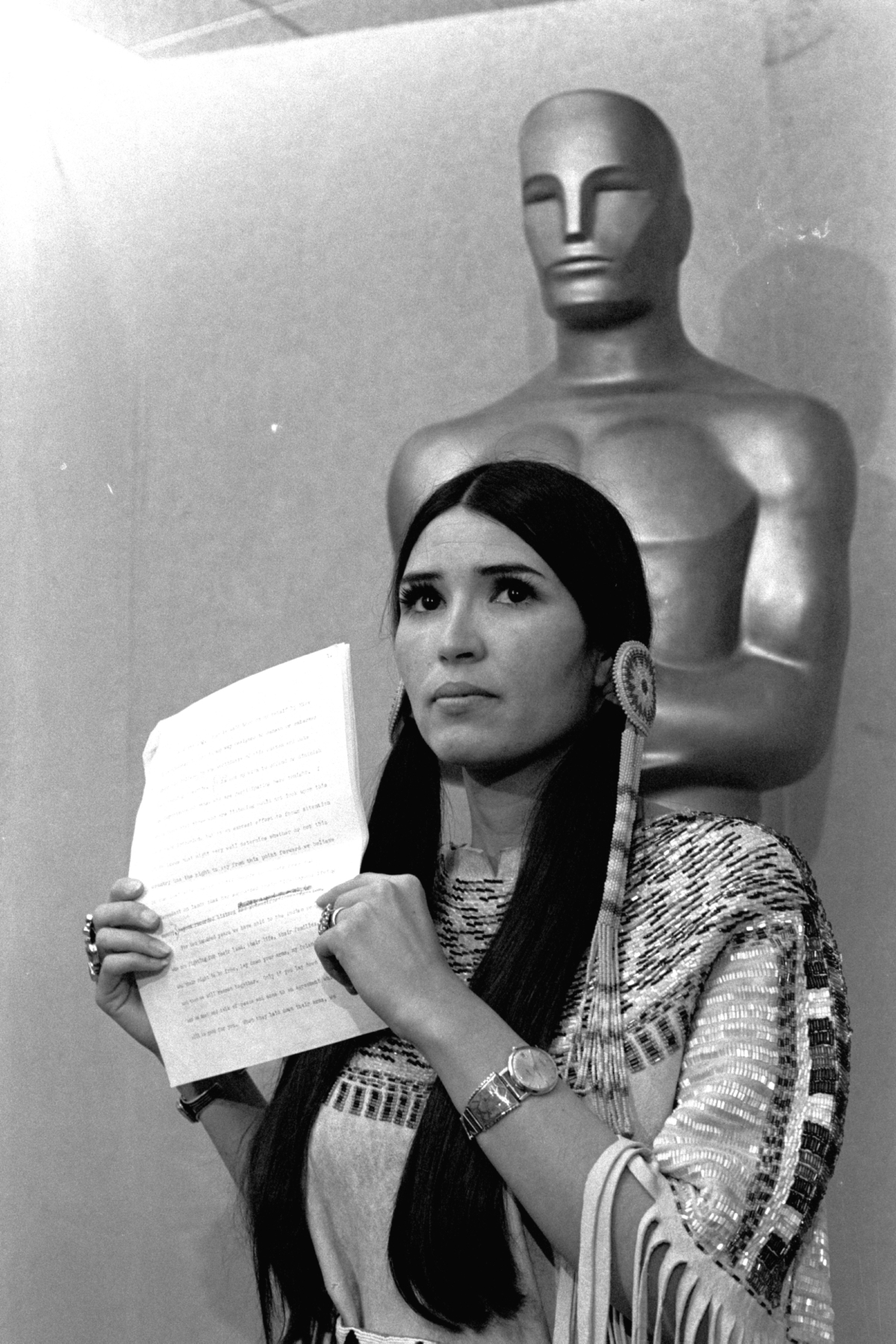 Sacheen Littlefeather, a Native American activist, tells the audience at the Academy Awards ceremony in Los Angeles, on March 27, 1973, that Marlon Brando was declining to accept his Oscar as best actor for his role in "The Godfather." (AP Photo)