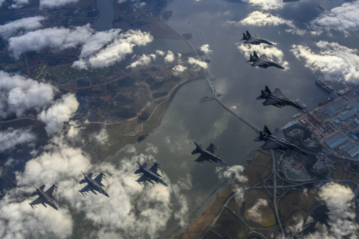 South Korean Air Force's F15K fighter jets and U.S. Air Force's F-16 fighter jets, fly in formation during a joint drill in an undisclosed location in South Korea on Oct. 4, 2022. (South Korean Defense Ministry via Getty Images)