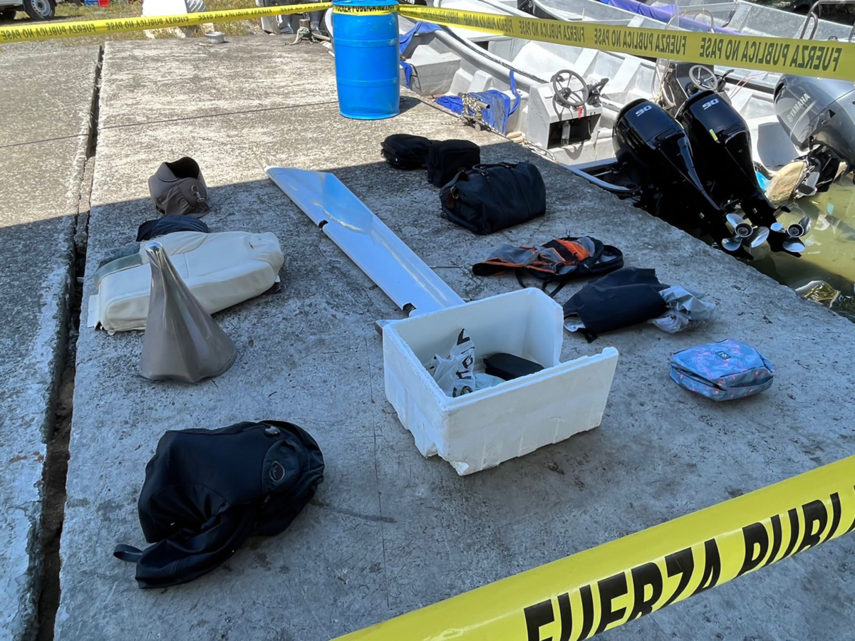 Flight passengers' personal belongings recovered from Caribbean waters along with pieces of a twin-engine turboprop aircraft, in Limon, Costa Rica, on Oct. 22, 2022. (Costa Rica Public Security Ministry Photo via AP)