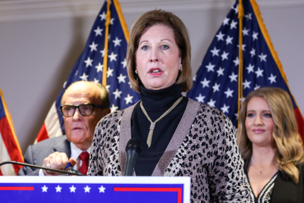 Trump campaign lawyer Sidney Powell speaks to media while flanked by Trump lawyer and former New York City Mayor Rudy Giuliani (L) and Trump campaign senior legal adviser Jenna Ellis at a press conference at the Republican National Committee headquarters in Washington, on Nov 19, 2020. (Charlotte Cuthbertson/The Epoch Times)