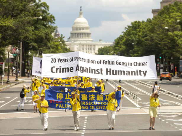 Falun-Gong-practitioners-take-part-in-a-parade-commemorating-the-20th-anniversary-of-the-persecution-of-Falun-Gong-in-China-in-Washington-on-July-18-2019.